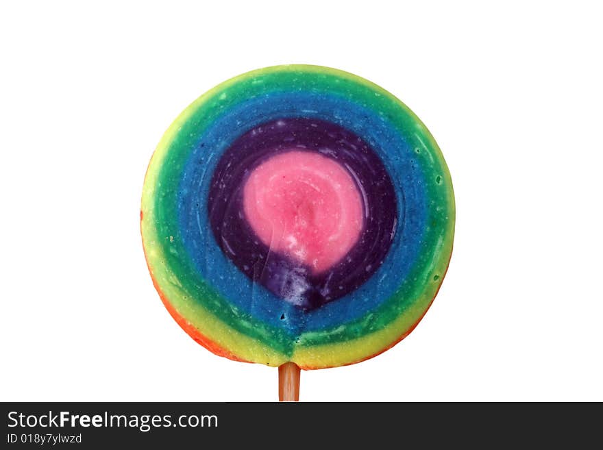 A brightly colored all-day lollipop on a wooden stick, isolated on a white background.