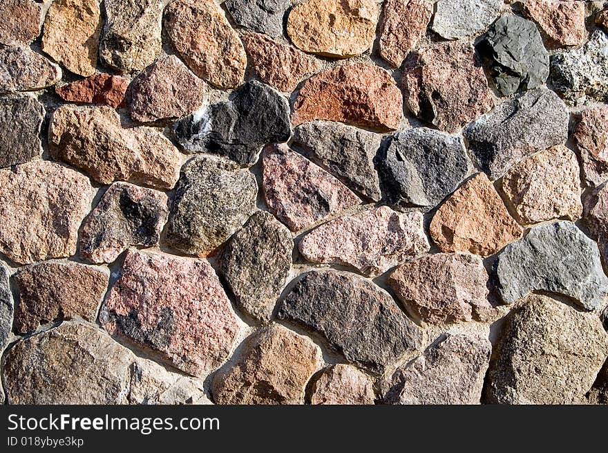 Brown stone wall of natural stones. Brown stone wall of natural stones