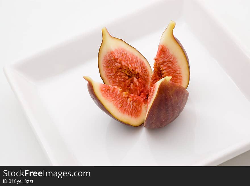 Fresh fig fruit on white plate