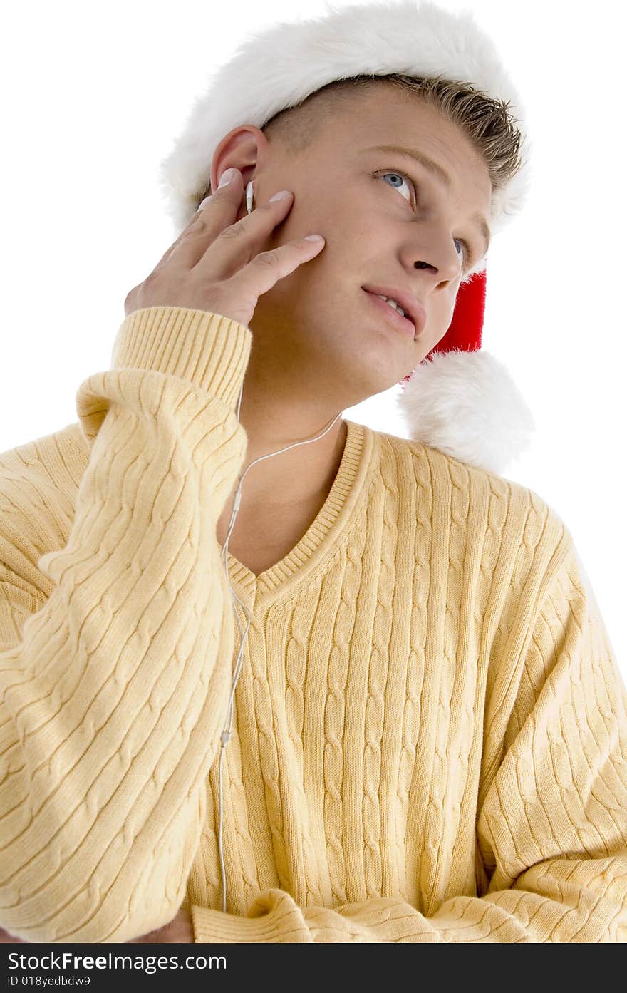 Male with christmas hat and looking upward  on an isolated white background