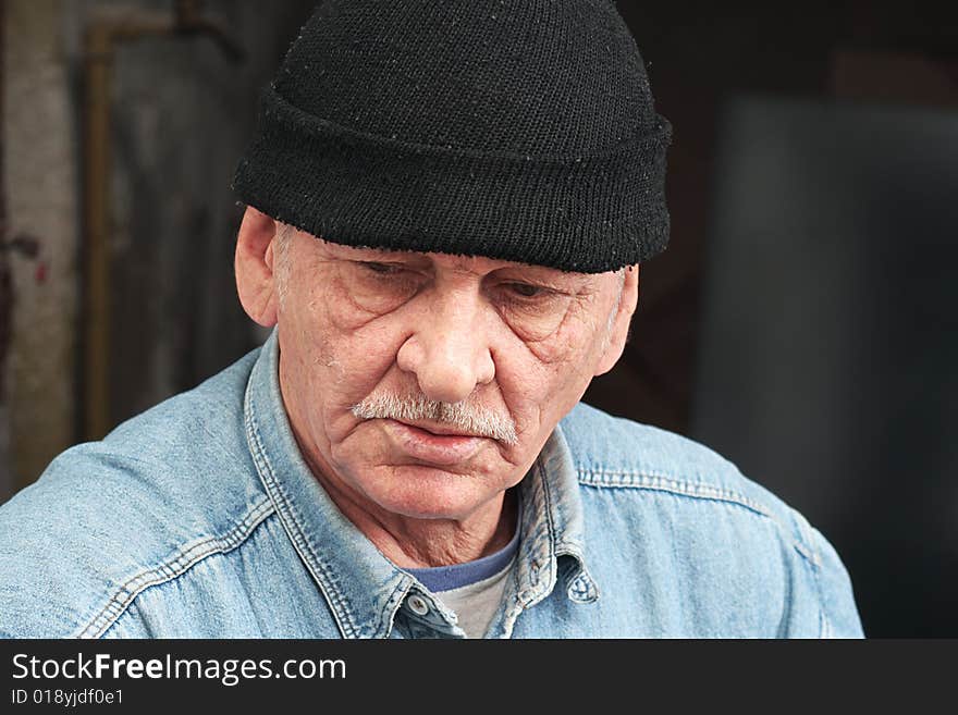 Old man in black hat