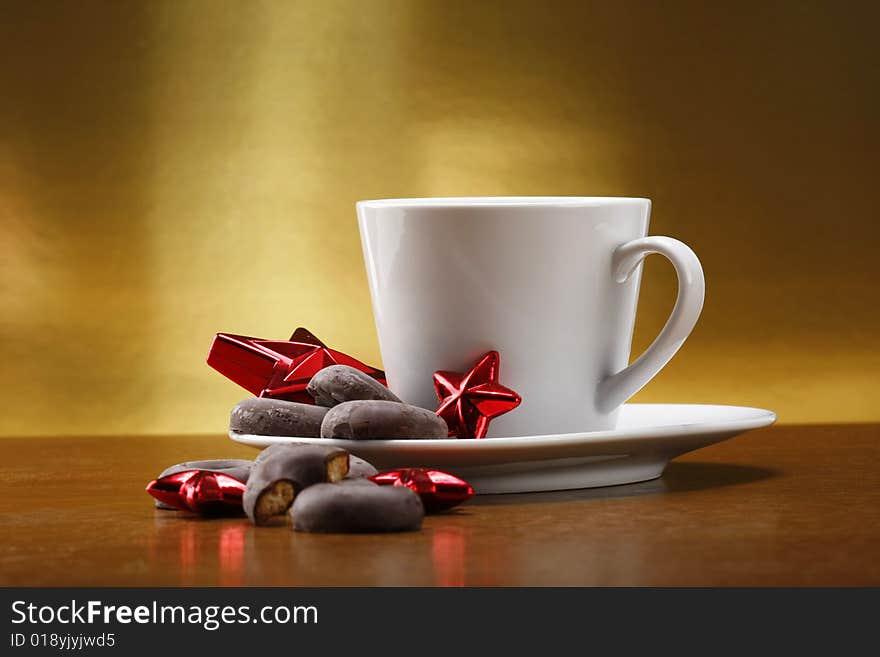 Milk and cookies for santa on table with gold background