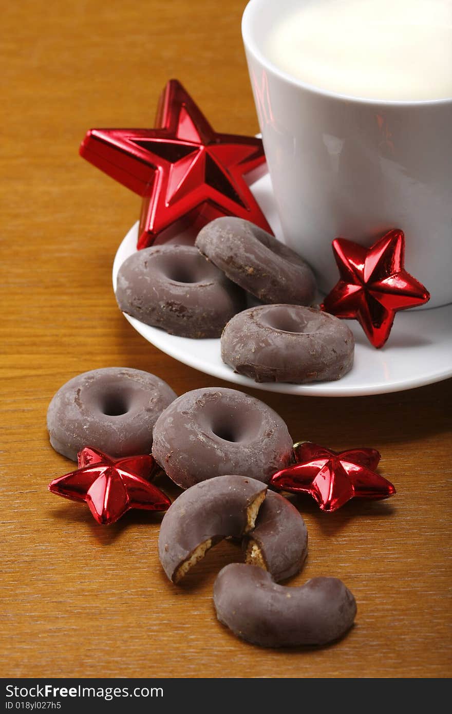 Milk and cookies for santa on table with gold background