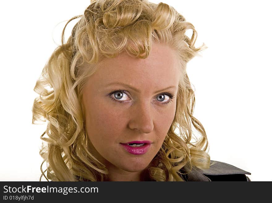 A close up of a woman with curly blonde hair and bright eyes. A close up of a woman with curly blonde hair and bright eyes