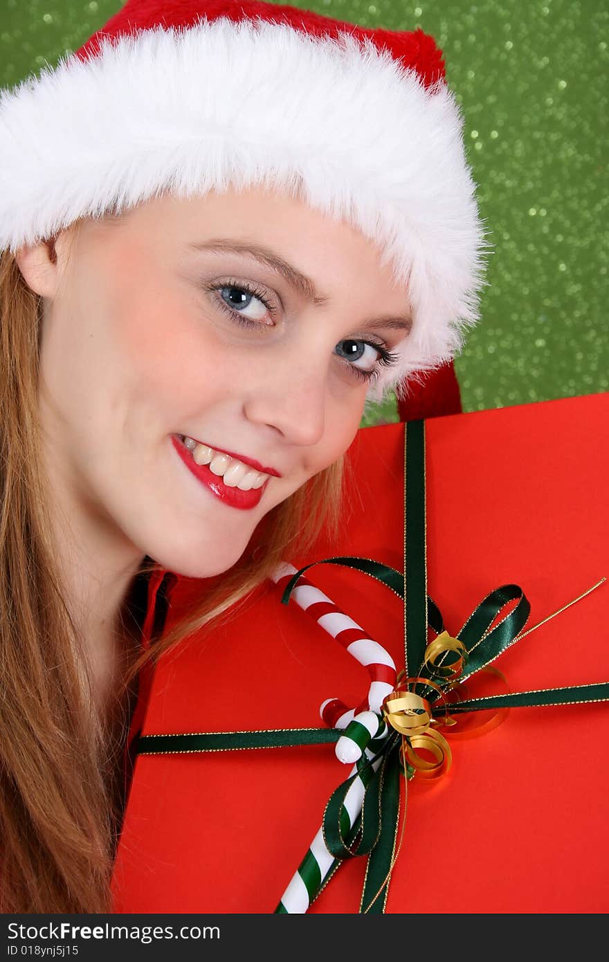 Teenager with red lips wearing a christmas hat. Teenager with red lips wearing a christmas hat