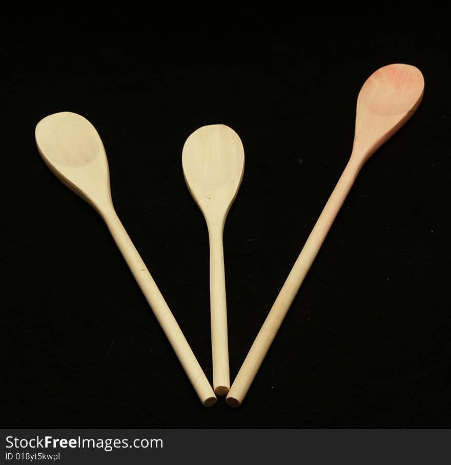 Three wooden spoons on a table