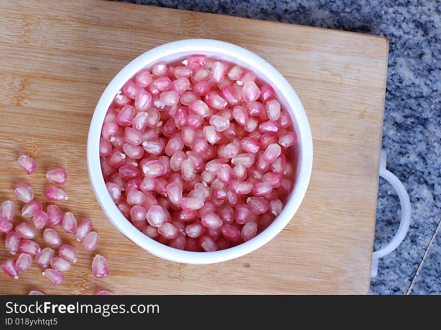 Red pomegranate in the bowl