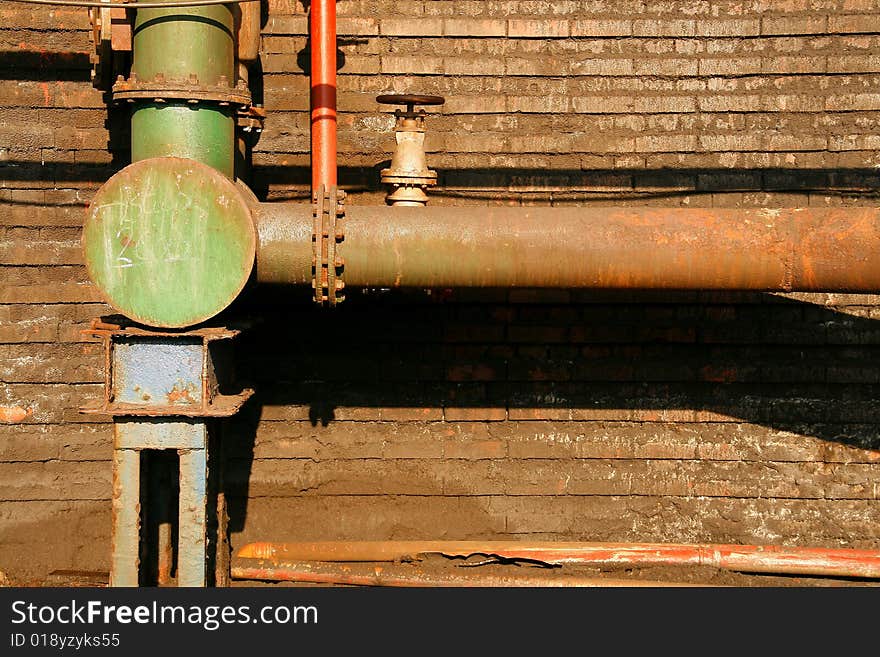 Pipe conducting water to coking chimney. Industrial architectural detail in Silesia (Poland)