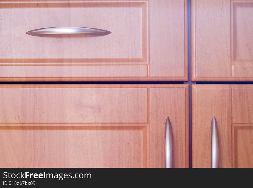 Kitchen wooden cupboard doors closeup. Kitchen wooden cupboard doors closeup