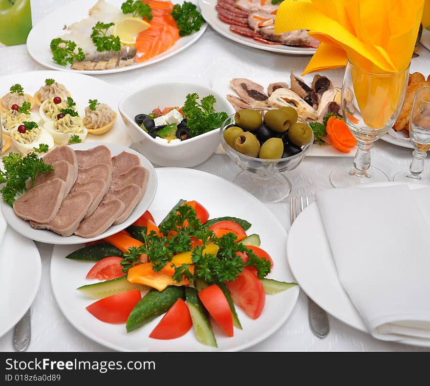 Table served with different dishes. Table served with different dishes