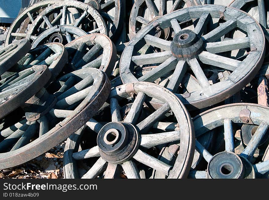 Pile of old wooden cartwheels. Pile of old wooden cartwheels