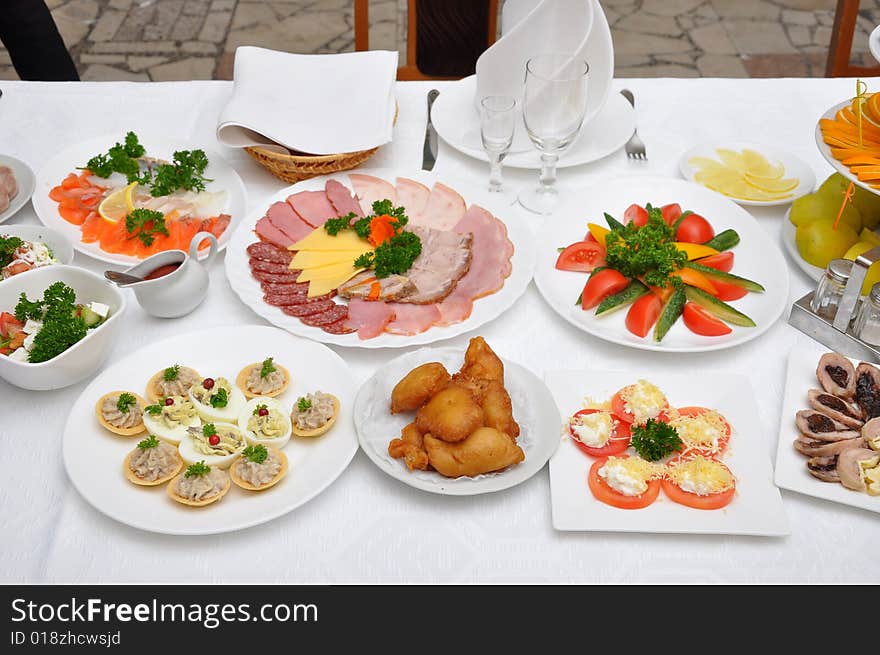 Table served with various dishes. Table served with various dishes