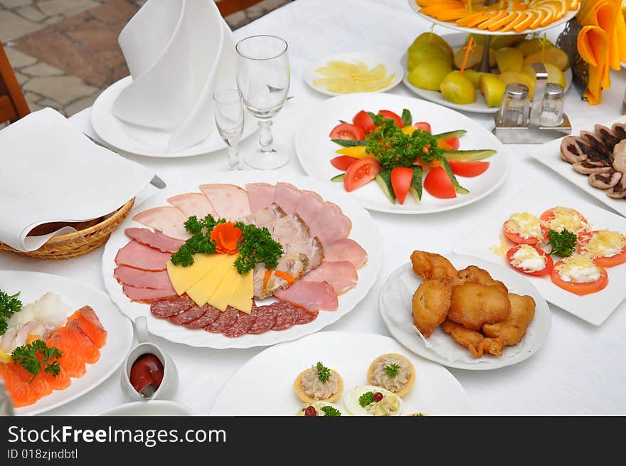 Table served with various dishes. Table served with various dishes