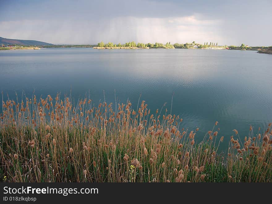 This is the lake of a small village named Ghioroc in the Zarand Mountains. This is the lake of a small village named Ghioroc in the Zarand Mountains