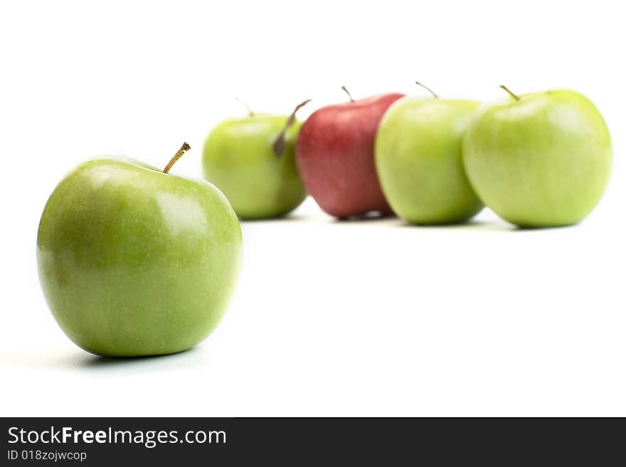 Group of green apples with one red. Group of green apples with one red