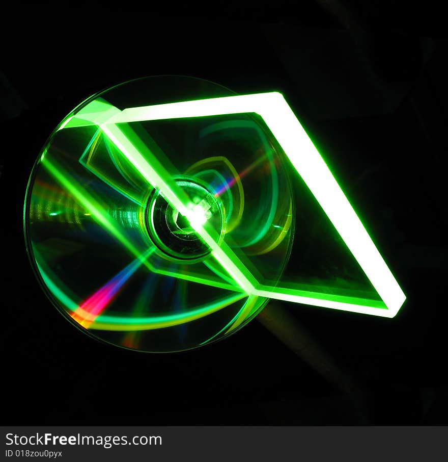 Transparent glass plate on a CD under a green laser beam