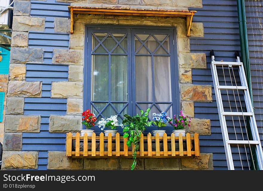 The window of a frame house.