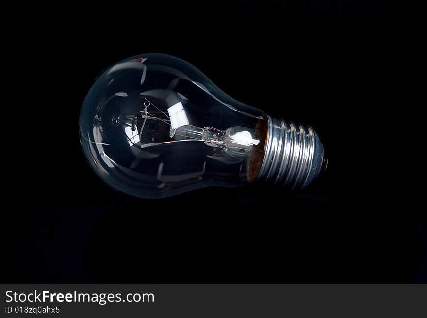 Classic light bulb isolated on black backgound. Classic light bulb isolated on black backgound.