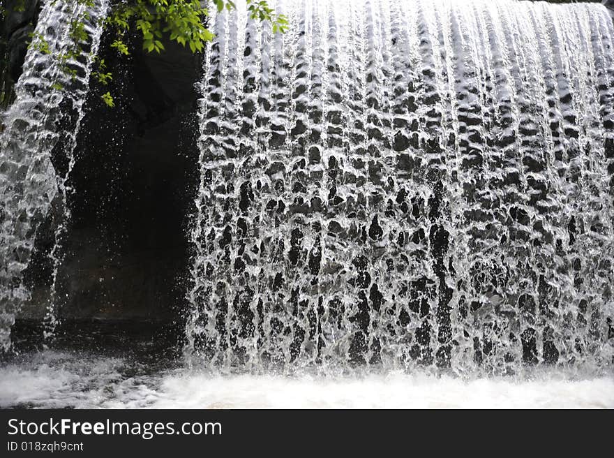 Waterfall over rocks in a forest