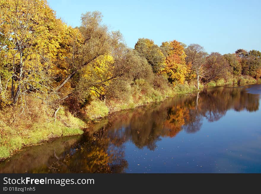 River surrounded by autumn colors. River surrounded by autumn colors