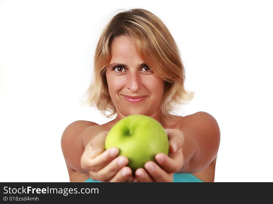 Portrait of a young beautiful woman holding a green apple