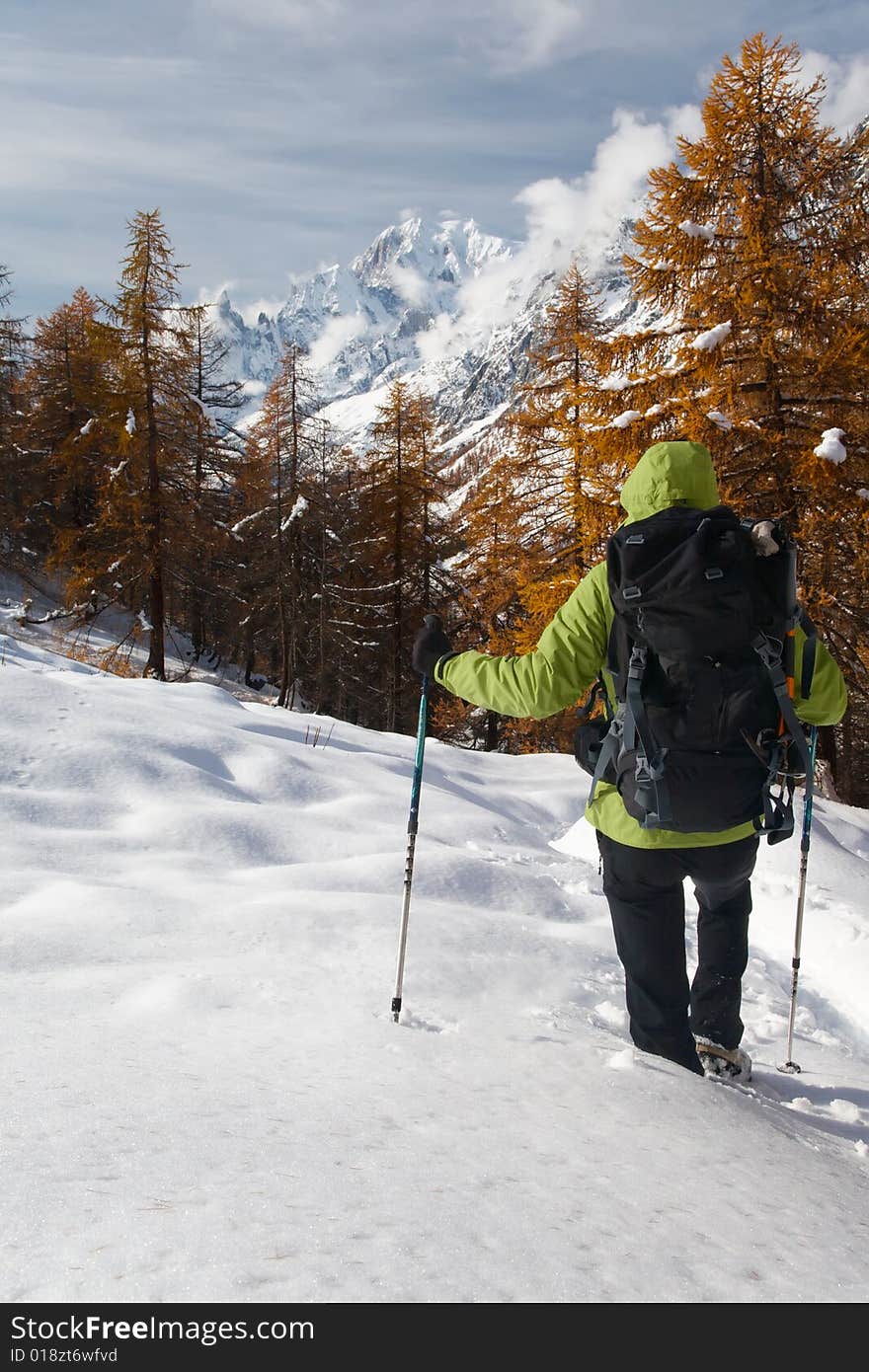 Hiker looking at the wild landscape of Mont Blanc, Italy. Hiker looking at the wild landscape of Mont Blanc, Italy.