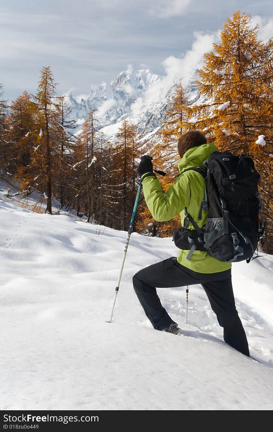 Lonely hiker looking at the wild landscape of Mont Blanc, Italy. Lonely hiker looking at the wild landscape of Mont Blanc, Italy.