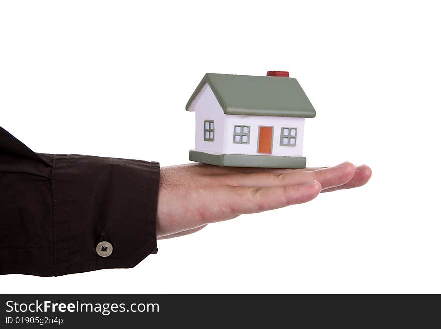 Man holding a small house in his hands