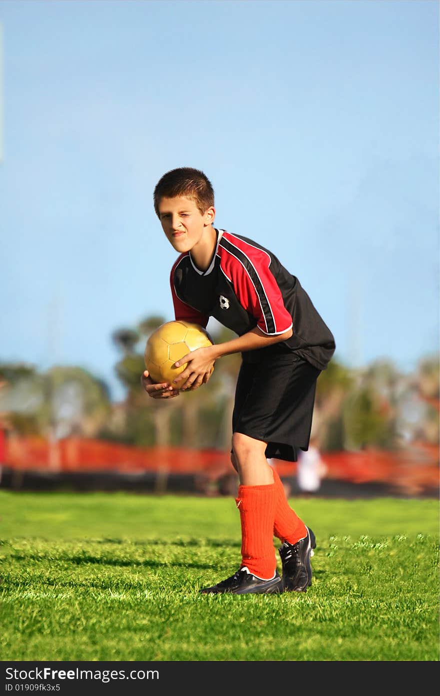 Youth Soccer player ready to kick goal