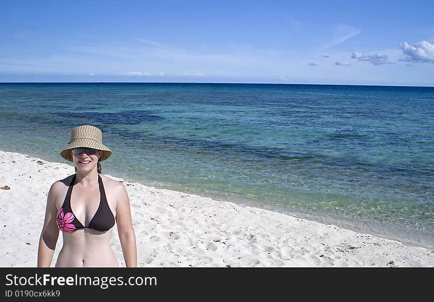 Beach scene with woman smiling. Beach scene with woman smiling.