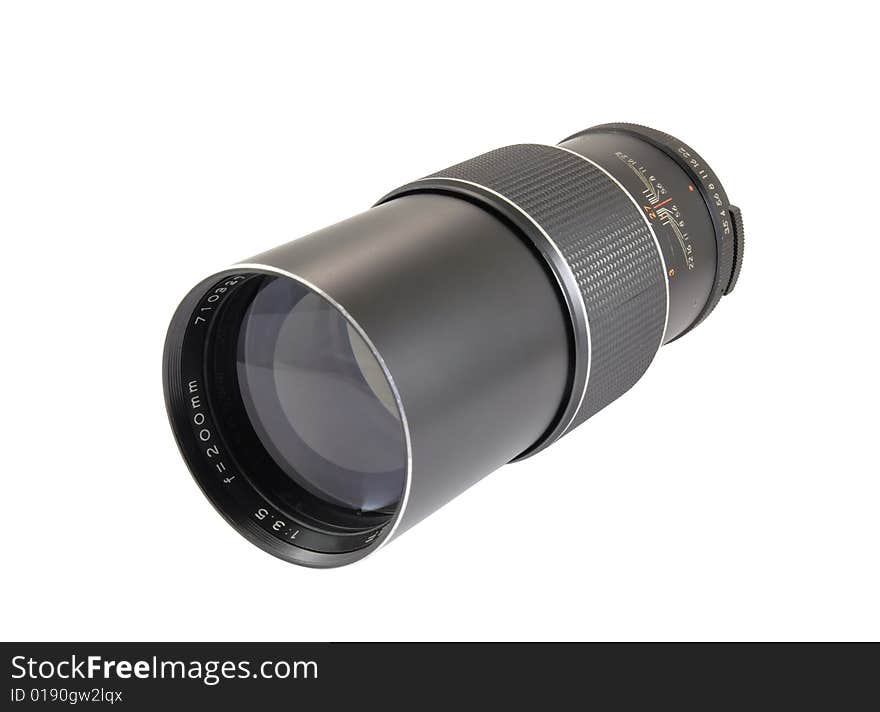 Vintage telephoto lens from the 1970s isolated on white