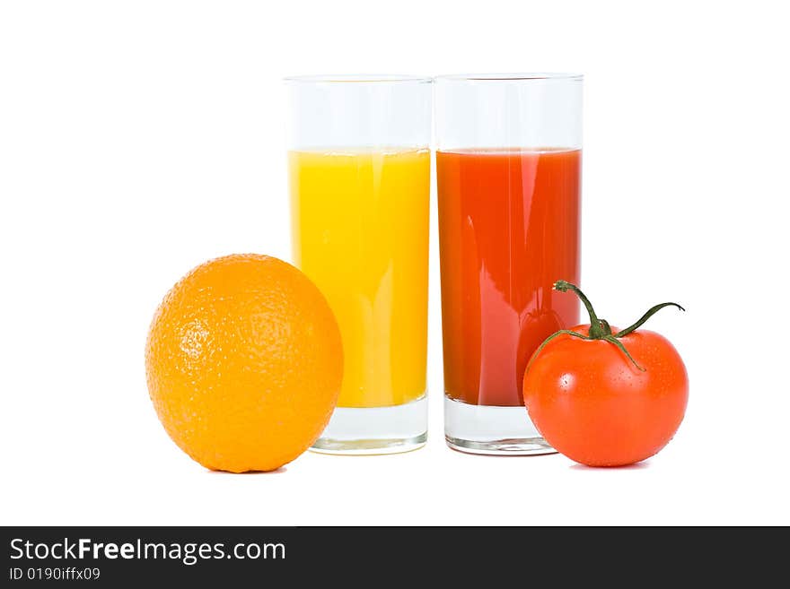 Orange and tomato fruits with juice in the glass