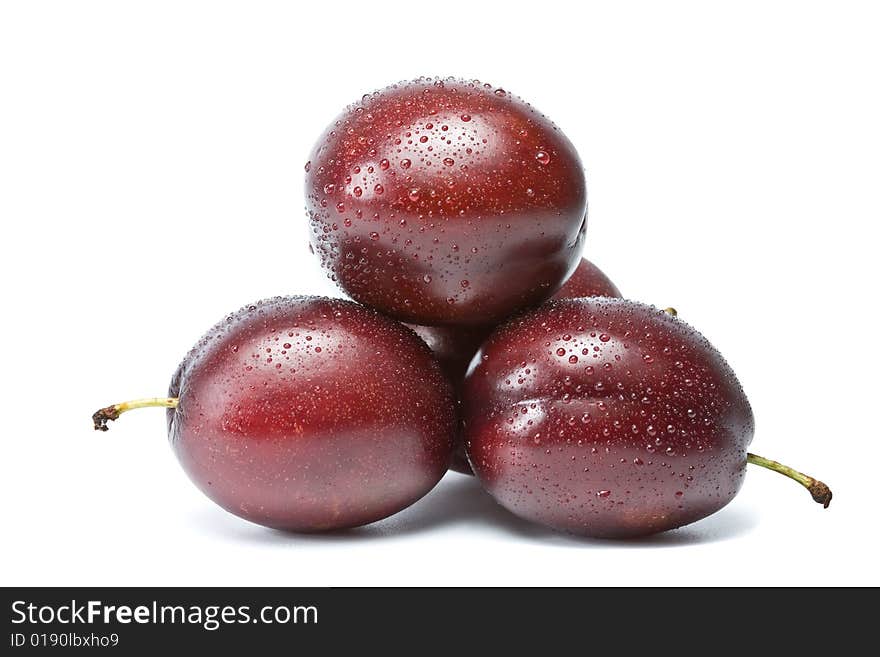 Three plums on a white background, isolation