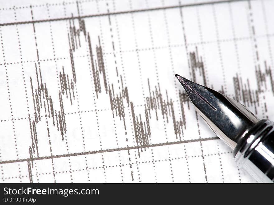 Stock photo: silver pen and financial report. Stock photo: silver pen and financial report