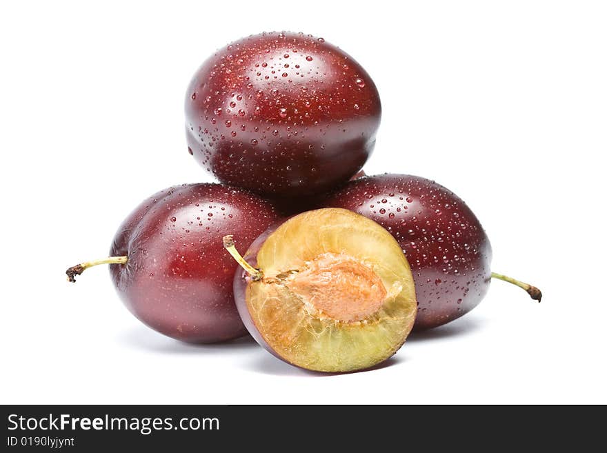 Three plums on a white background, isolation