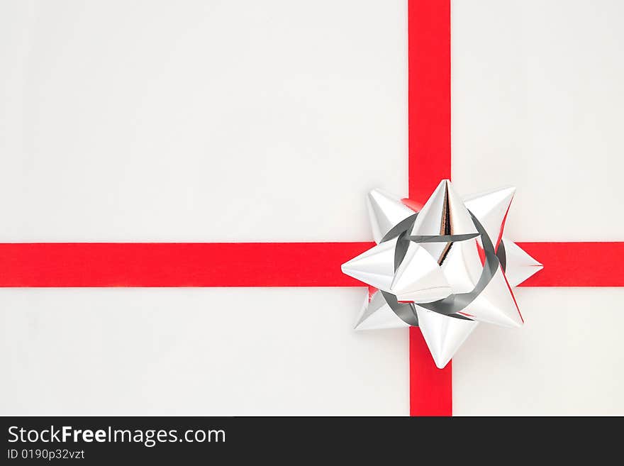 Silver and red bow isolated on white background