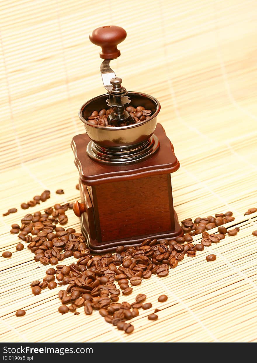 Coffee grinder against coffee grains