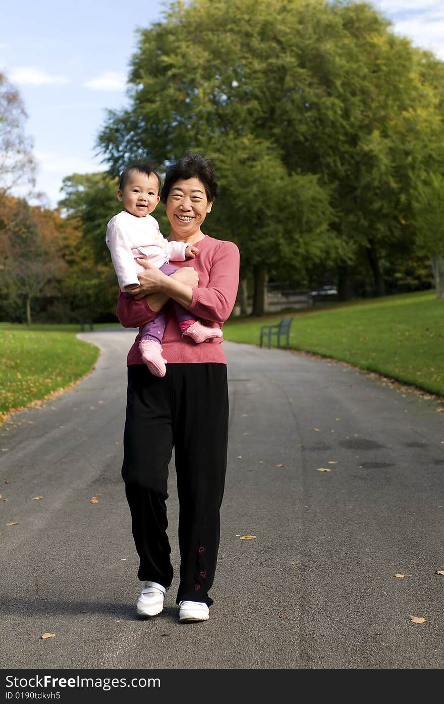 Grandmother and granddaughter in park