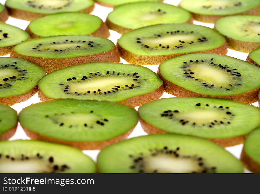 Background of juicy fresh sliced kiwi on white. Background of juicy fresh sliced kiwi on white