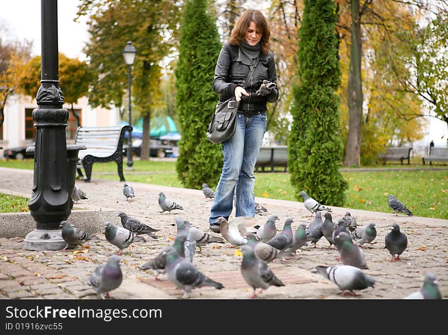 Girl with doves in the park