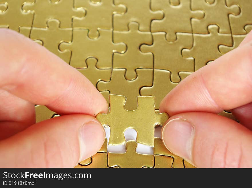 Hands holding a puzzle piece . business concepts. Hands holding a puzzle piece . business concepts