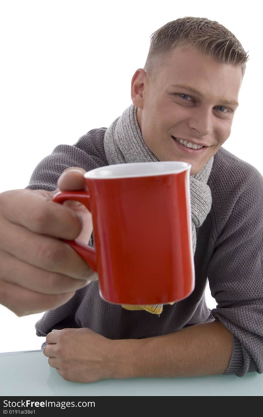 Handsome Young Man Showing Coffee Mug