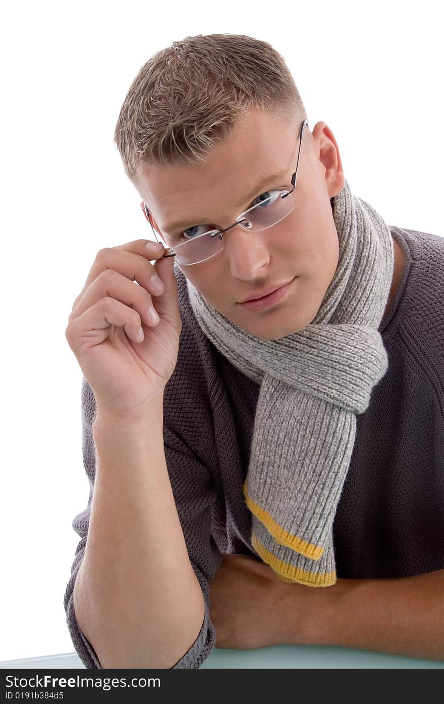 Young male holding eyewear on an isolated white background