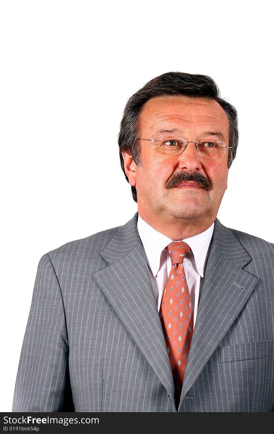 A businessman in his sixties with glasses a suit and a mustache. Isolated over white. A businessman in his sixties with glasses a suit and a mustache. Isolated over white.