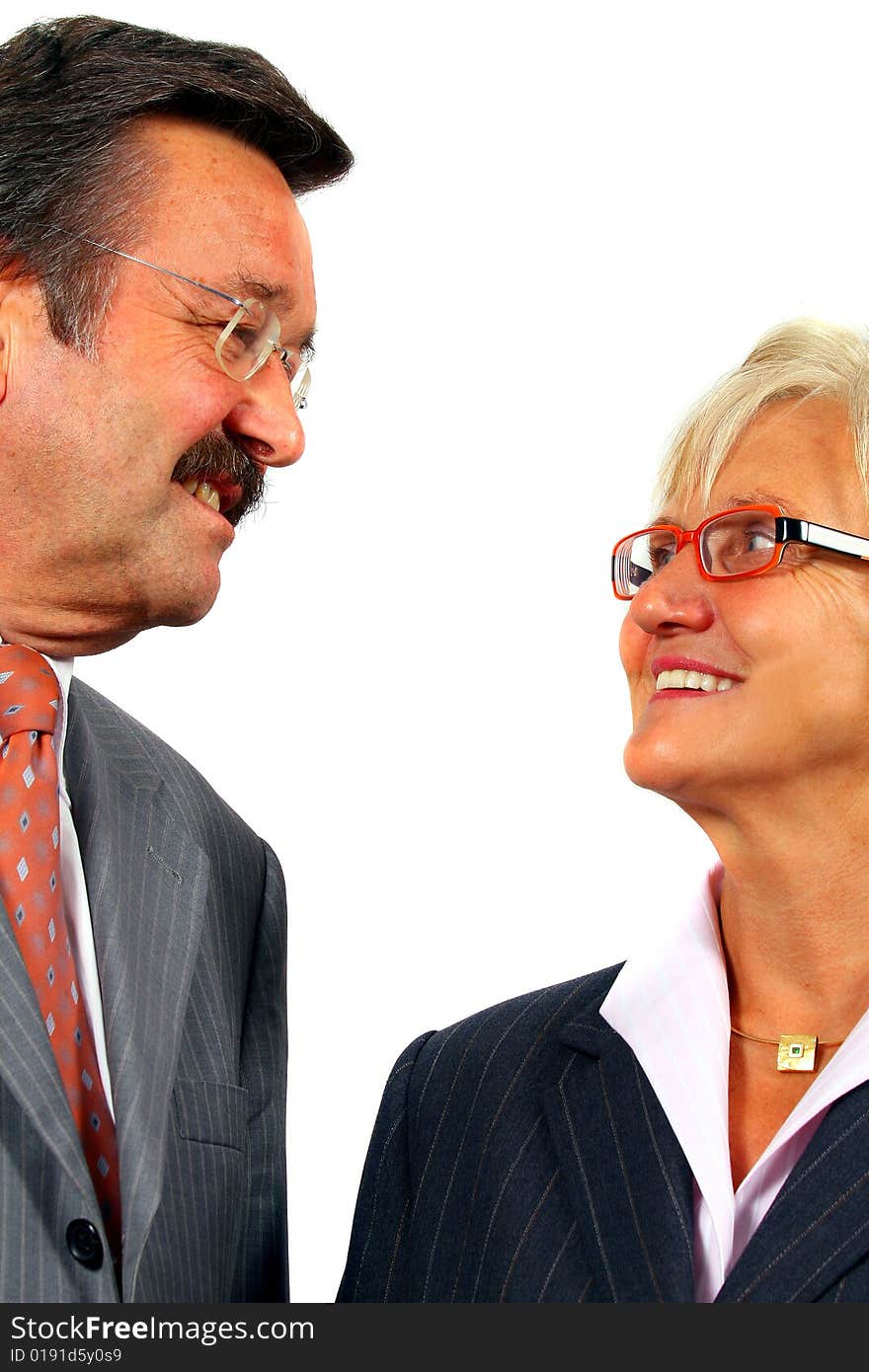 A business woman and a man looking at each other. Isolated over white. A business woman and a man looking at each other. Isolated over white.