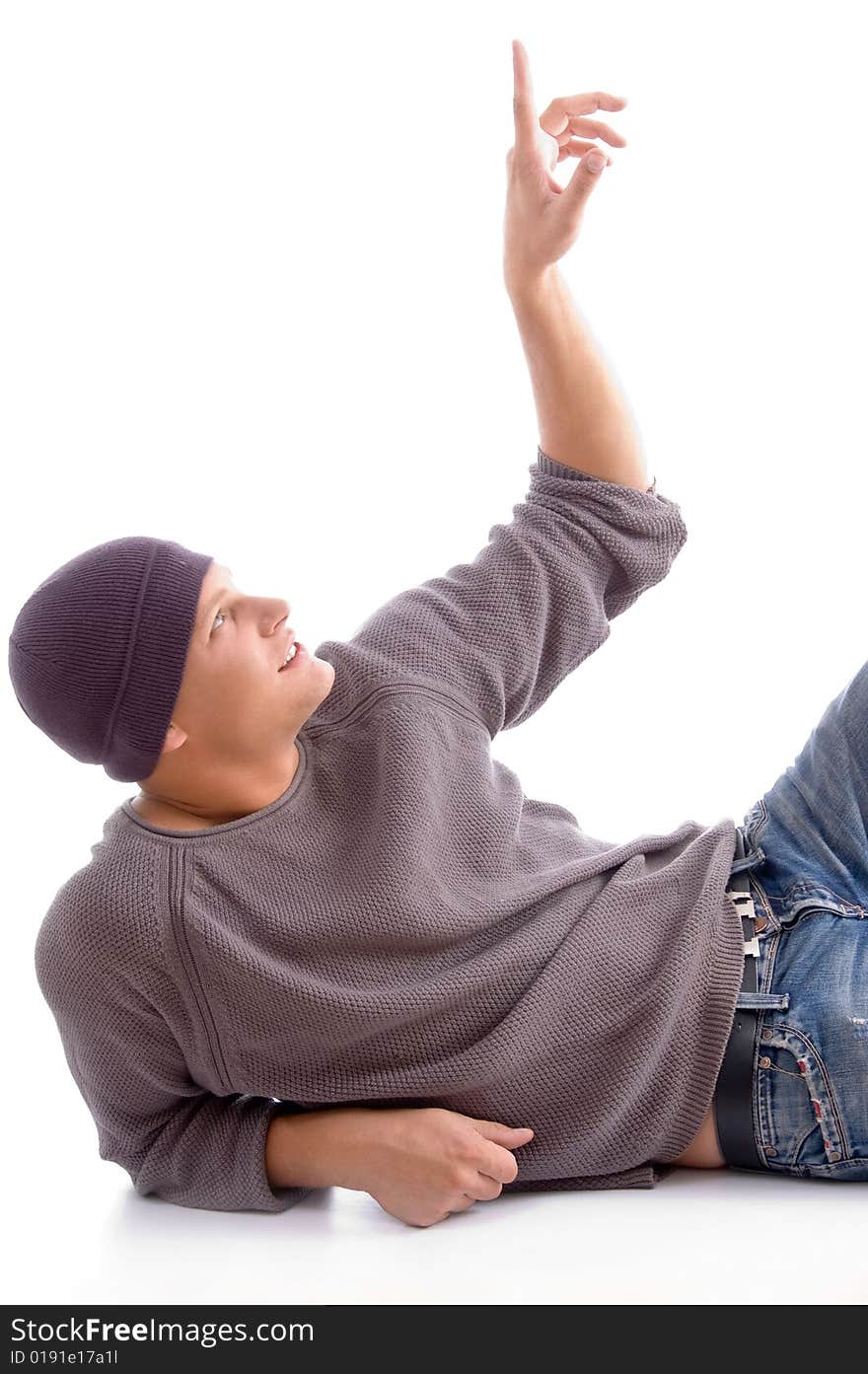 Young american man posing with woolen cap against white background