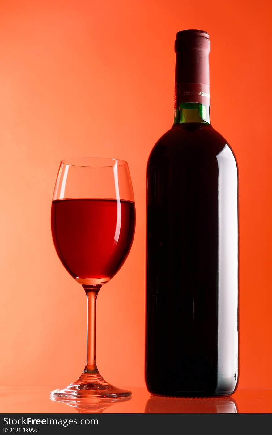 Glass and bottle of red wine