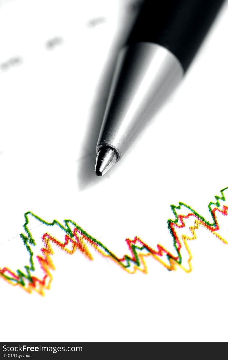 Closeup of stock chart showing losses with pen. Closeup of stock chart showing losses with pen