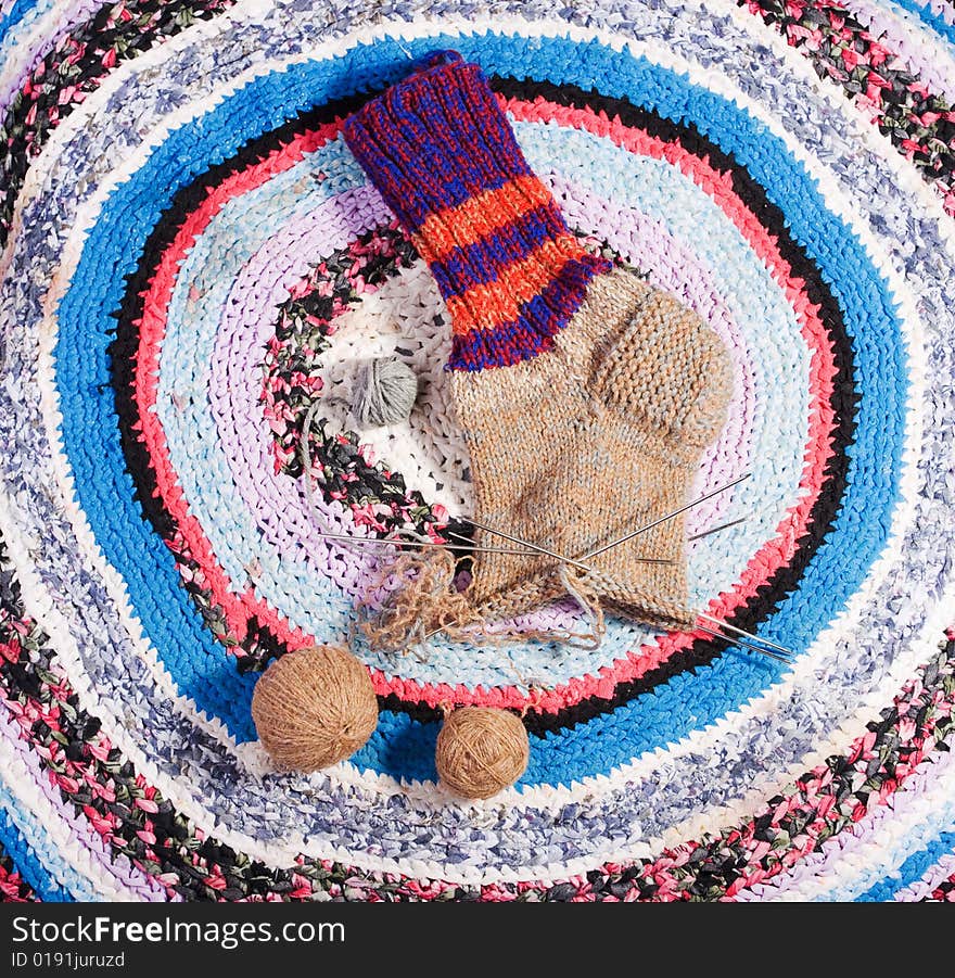 Homemade sock on a homemade carpet. Homemade sock on a homemade carpet