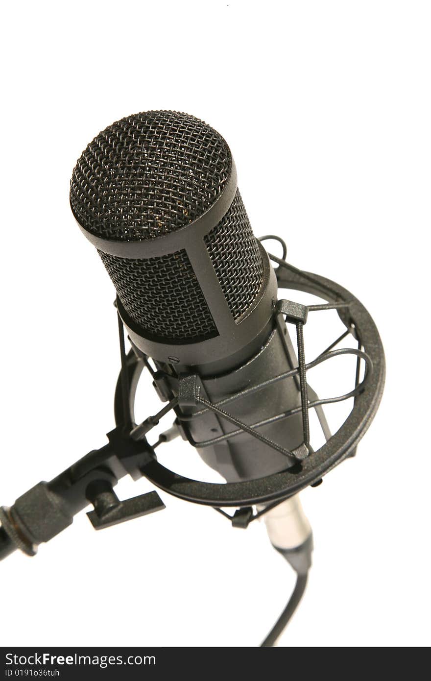 Black studio microphone isolated on the white background